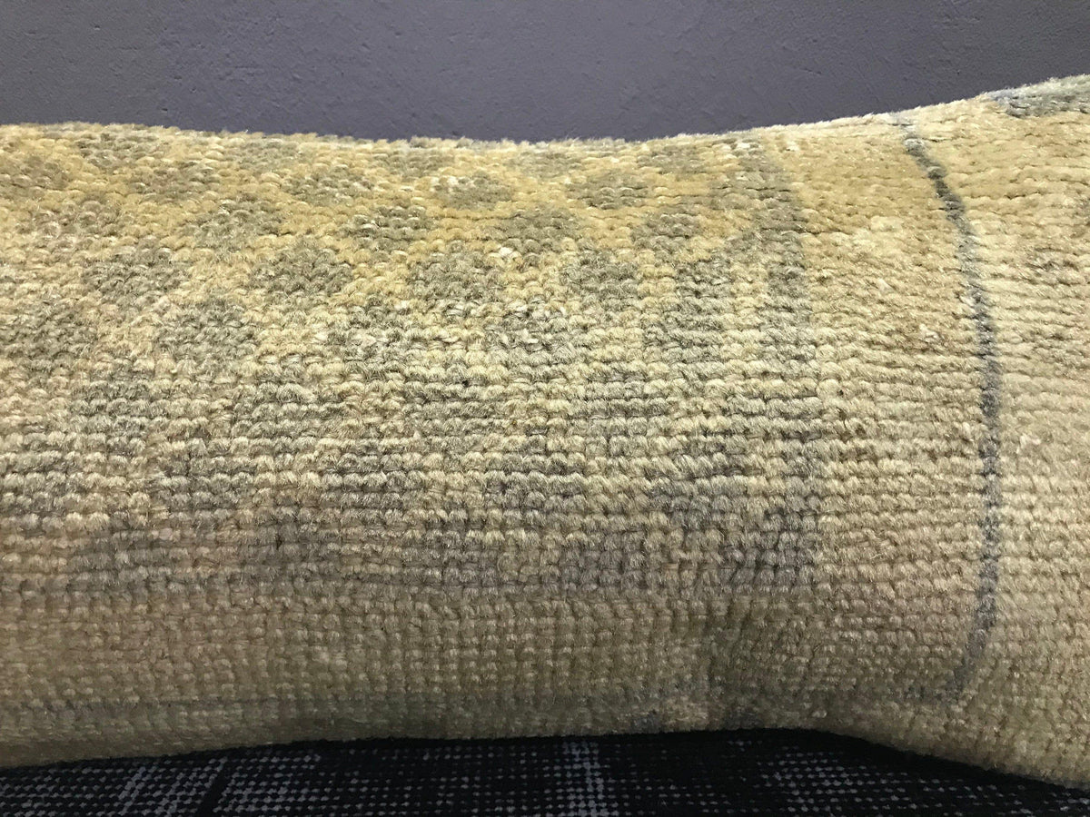 Close-up of the beige Turkish throw pillow showing traditional details, low pile.