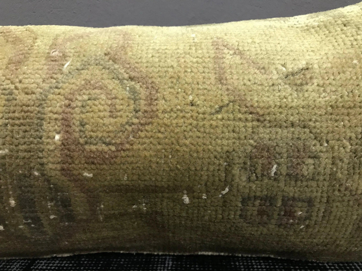 Close-up of the beige Turkish throw pillow showing neutral details, low pile.