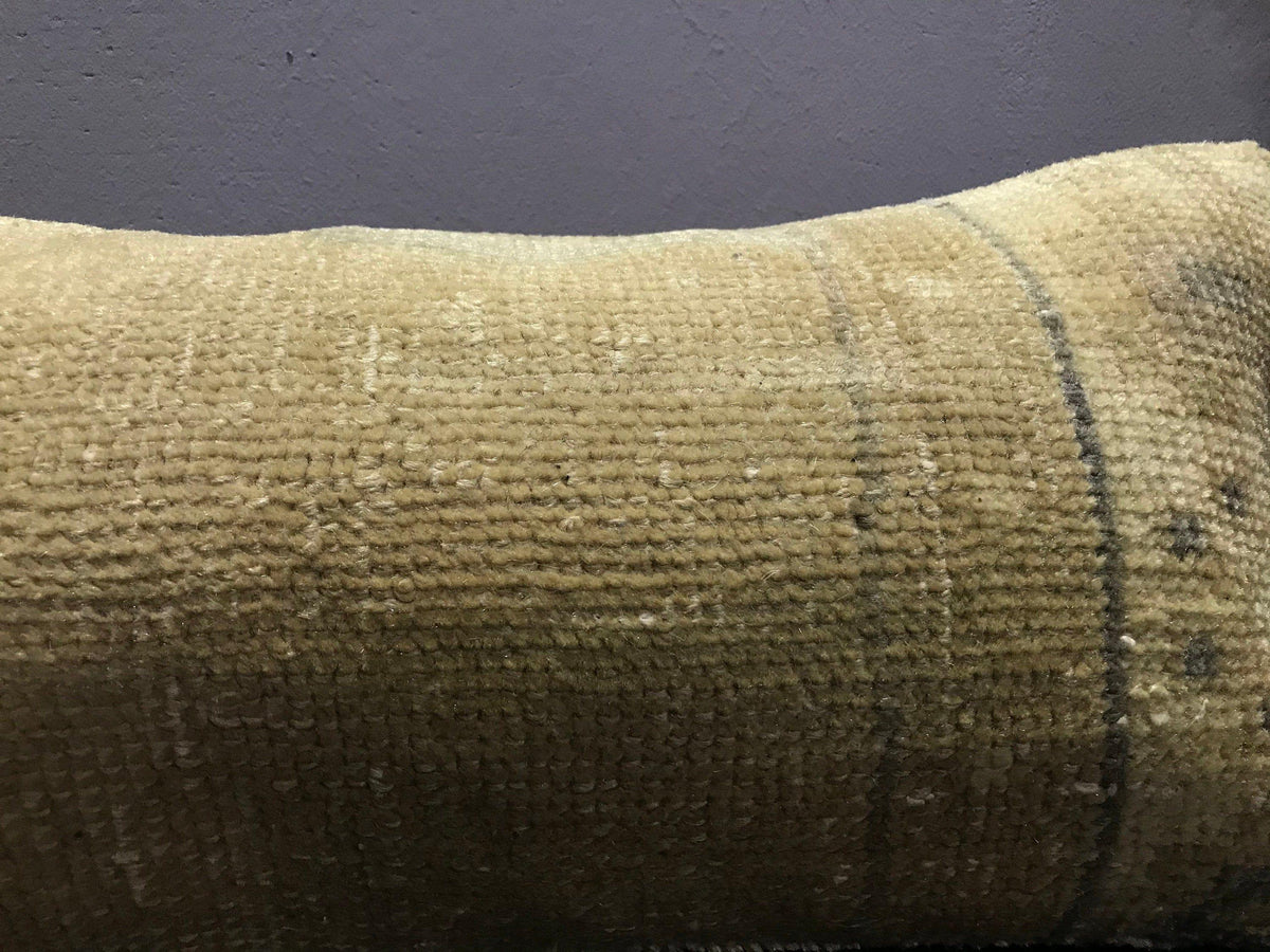 Close-up of the beige Turkish throw pillow showing traditional details, low pile.