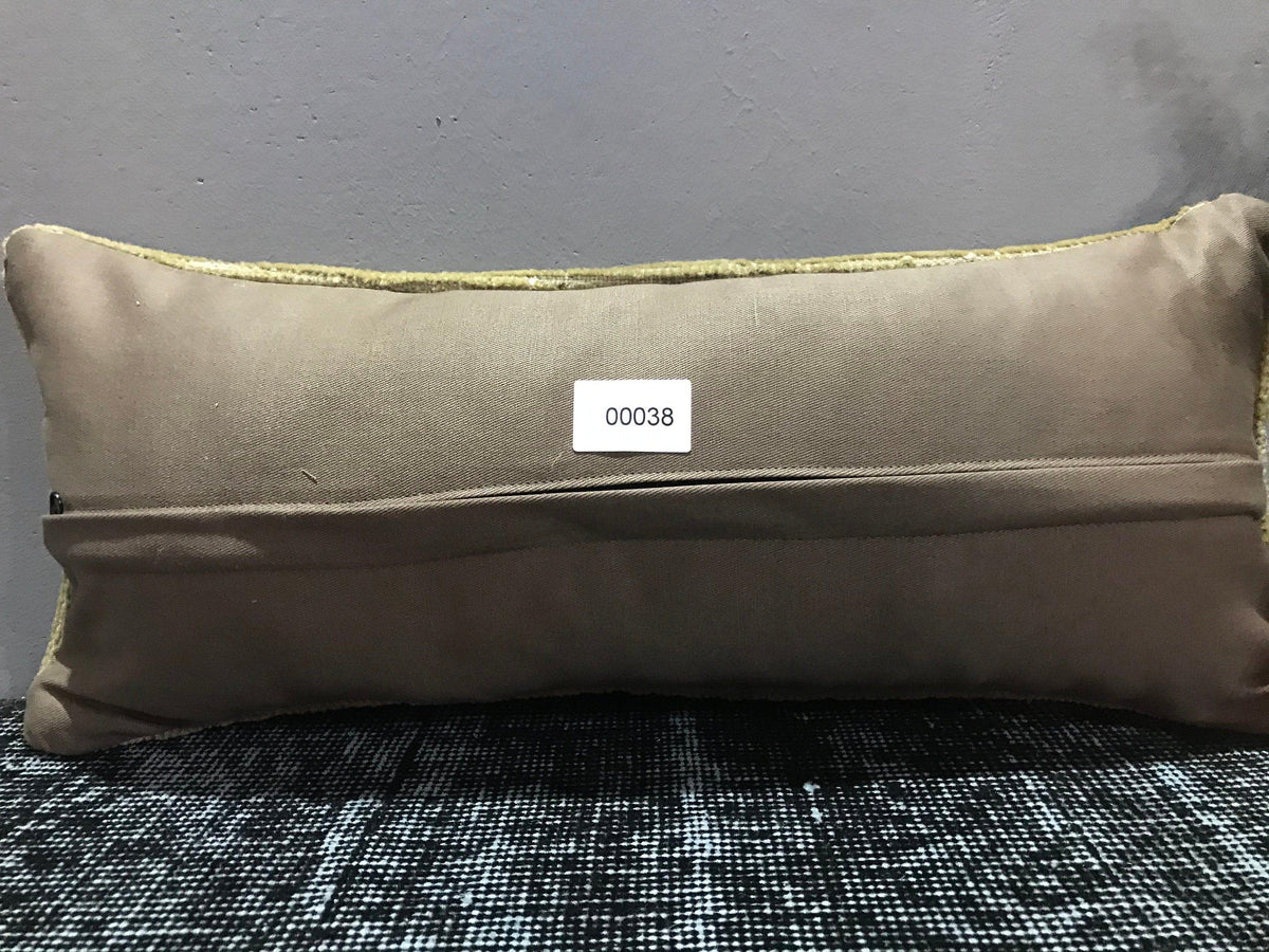 Beige Turkish throw pillow, shown on the floor.