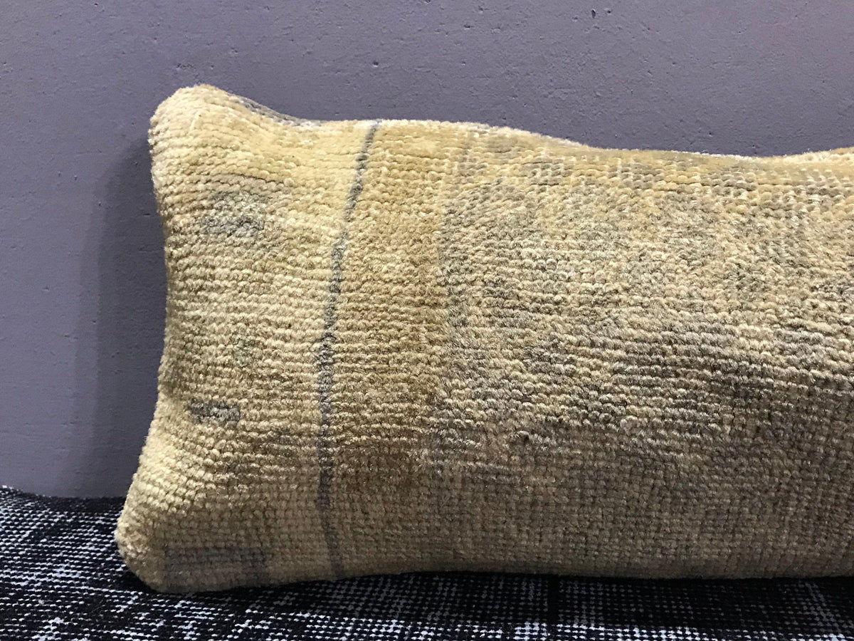 Close-up of the beige Turkish throw pillow showing traditional details, low pile.