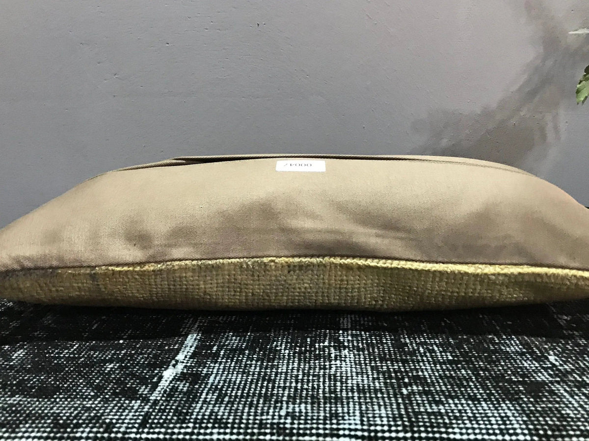 Beige Turkish throw pillow, shown on the floor.