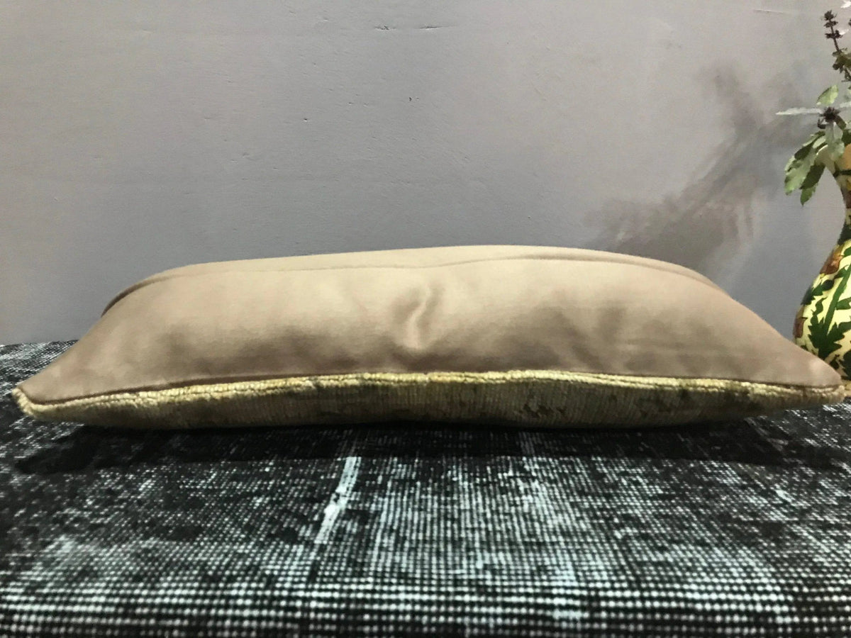 Beige Turkish throw pillow, shown on the floor.