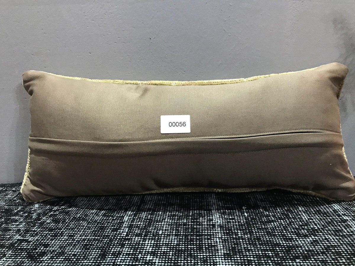 Beige Turkish throw pillow, shown on the floor.