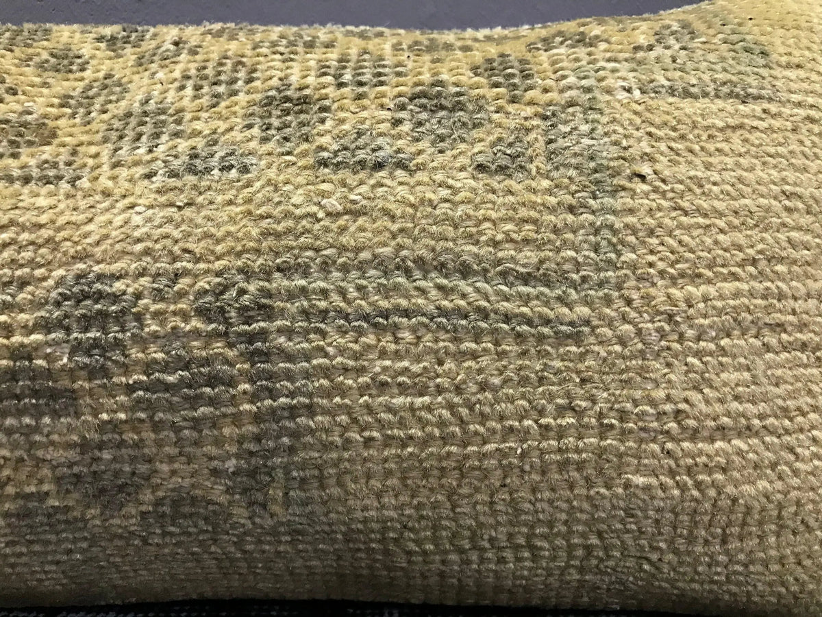 Close-up of the beige Turkish throw pillow showing neutral details, low pile.