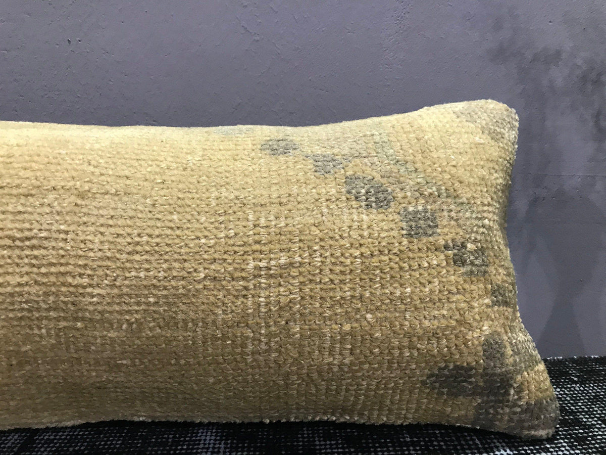 Close-up of the beige Turkish throw pillow showing traditional details, low pile.