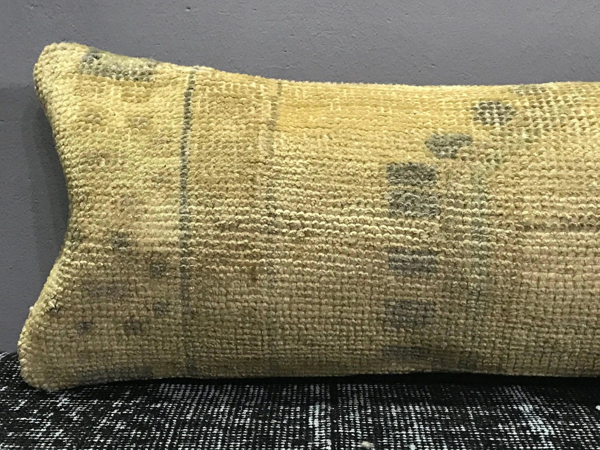 Close-up of the beige Turkish throw pillow showing traditional details, low pile.