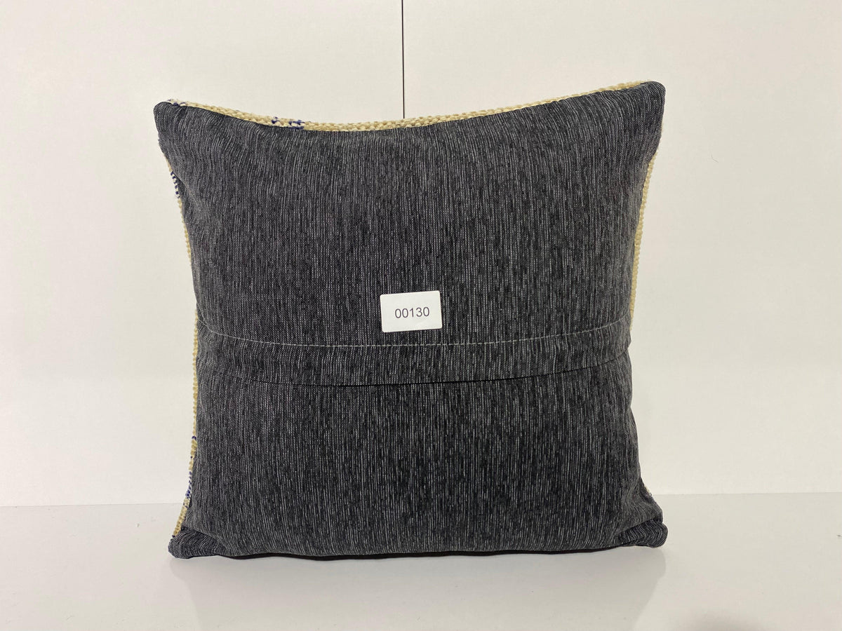 Close-up of the blue Turkish throw pillow showing neutral details, low pile.