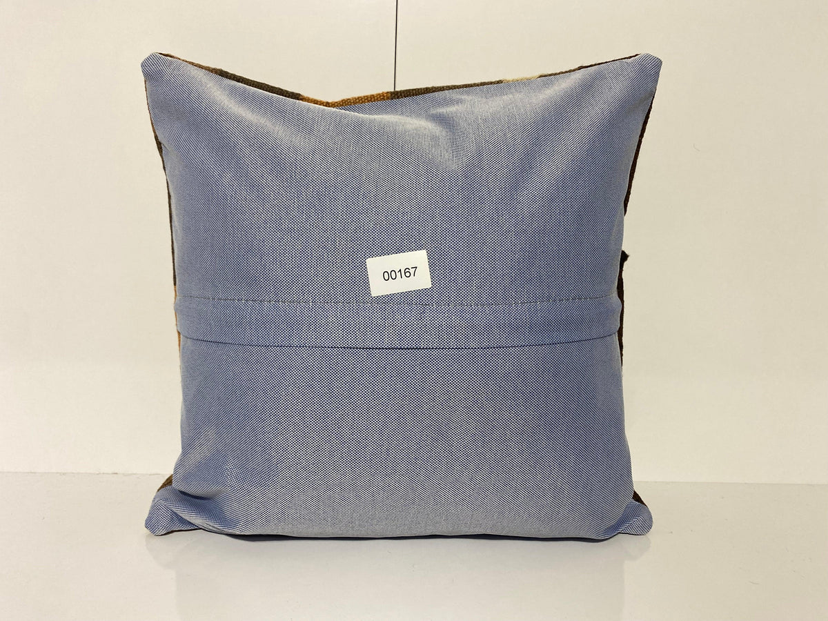 Close-up of the brown Turkish throw pillow showing traditional details, low pile.