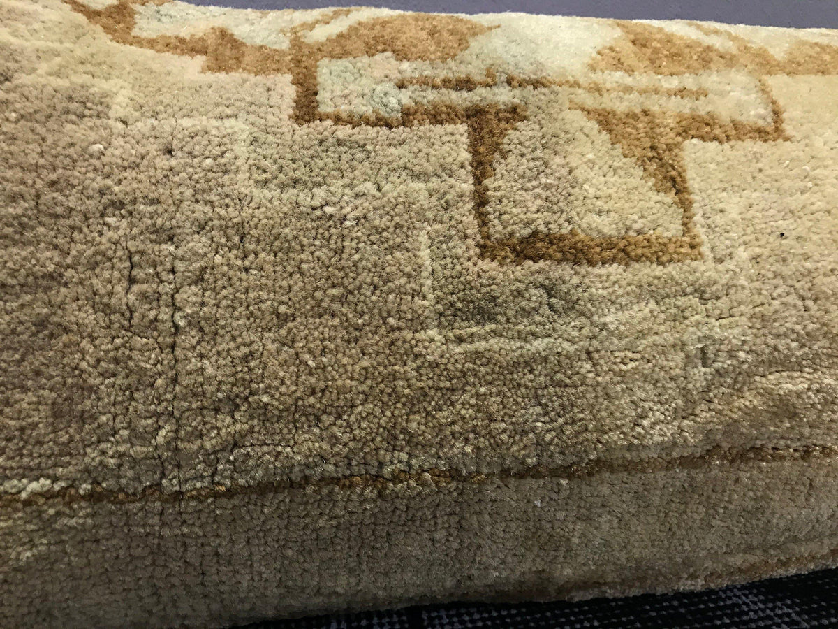 Close-up of the brown Turkish throw pillow showing neutral details, low pile.