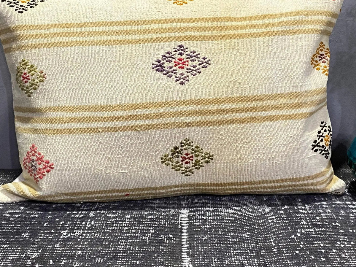 Close-up of the colorful Turkish throw pillow showing traditional details, low pile.