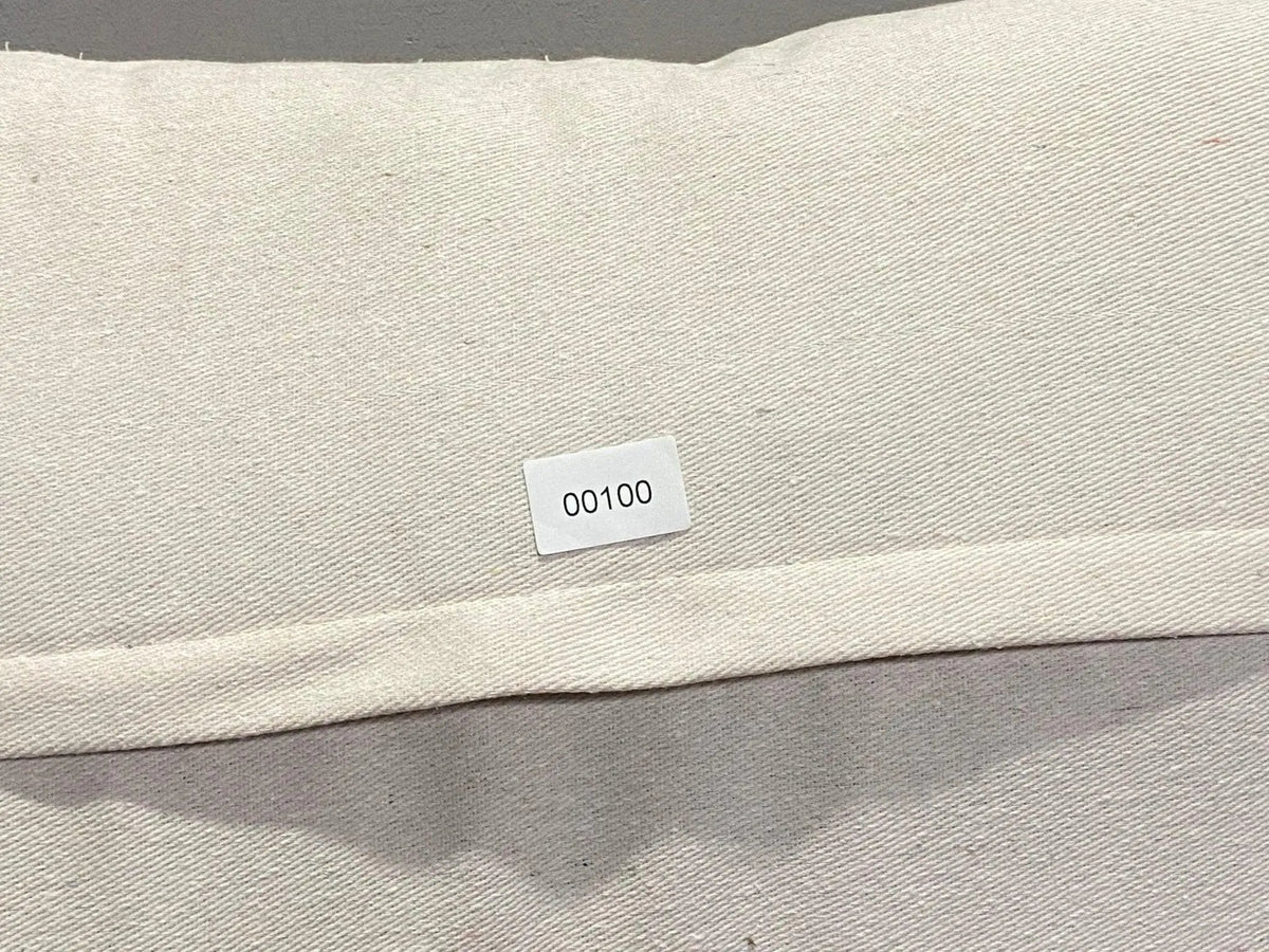 Colorful Turkish throw pillow, shown on the floor.