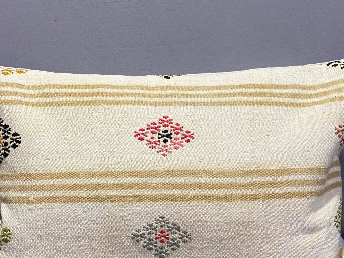 Close-up of the colorful Turkish throw pillow showing traditional details, low pile.