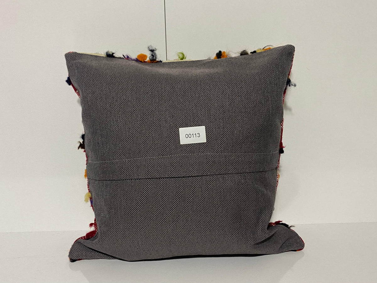 Close-up of the colorful Turkish throw pillow showing traditional details, low pile.