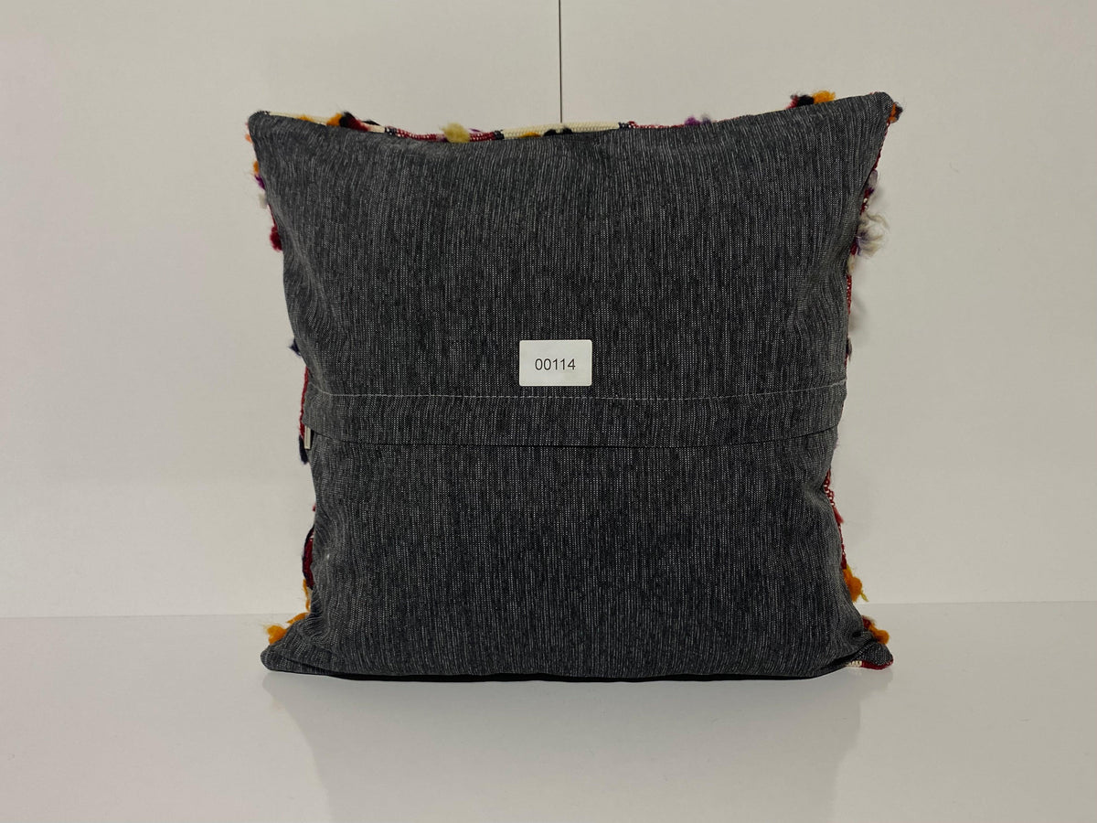 Close-up of the colorful Turkish throw pillow showing traditional details, low pile.