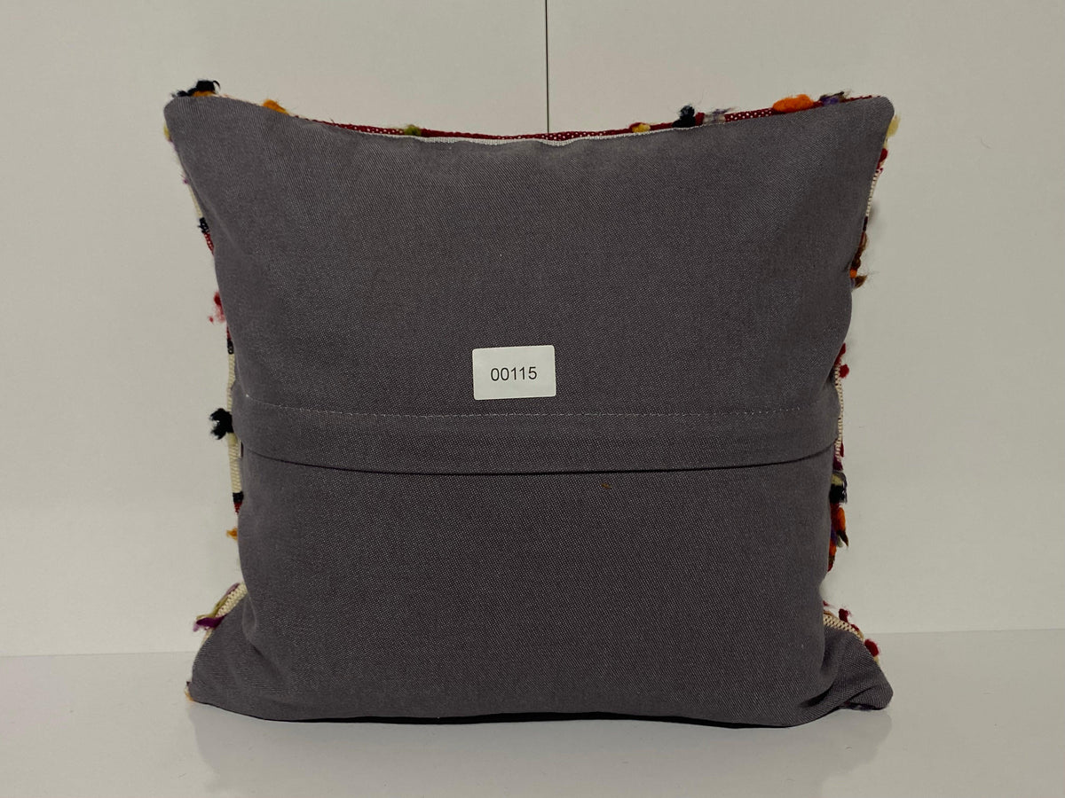 Close-up of the colorful Turkish throw pillow showing traditional details, low pile.
