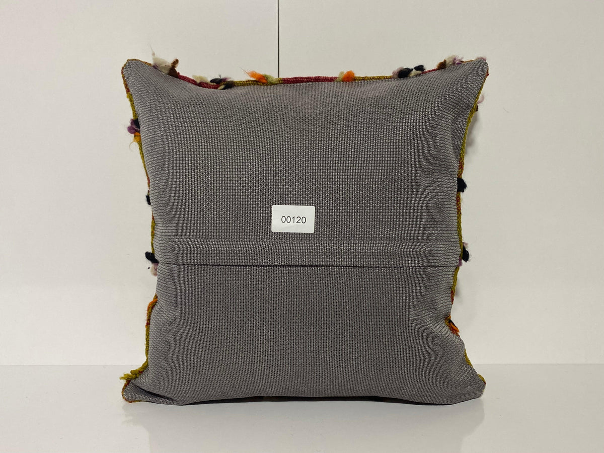 Close-up of the colorful Turkish throw pillow showing traditional details, low pile.