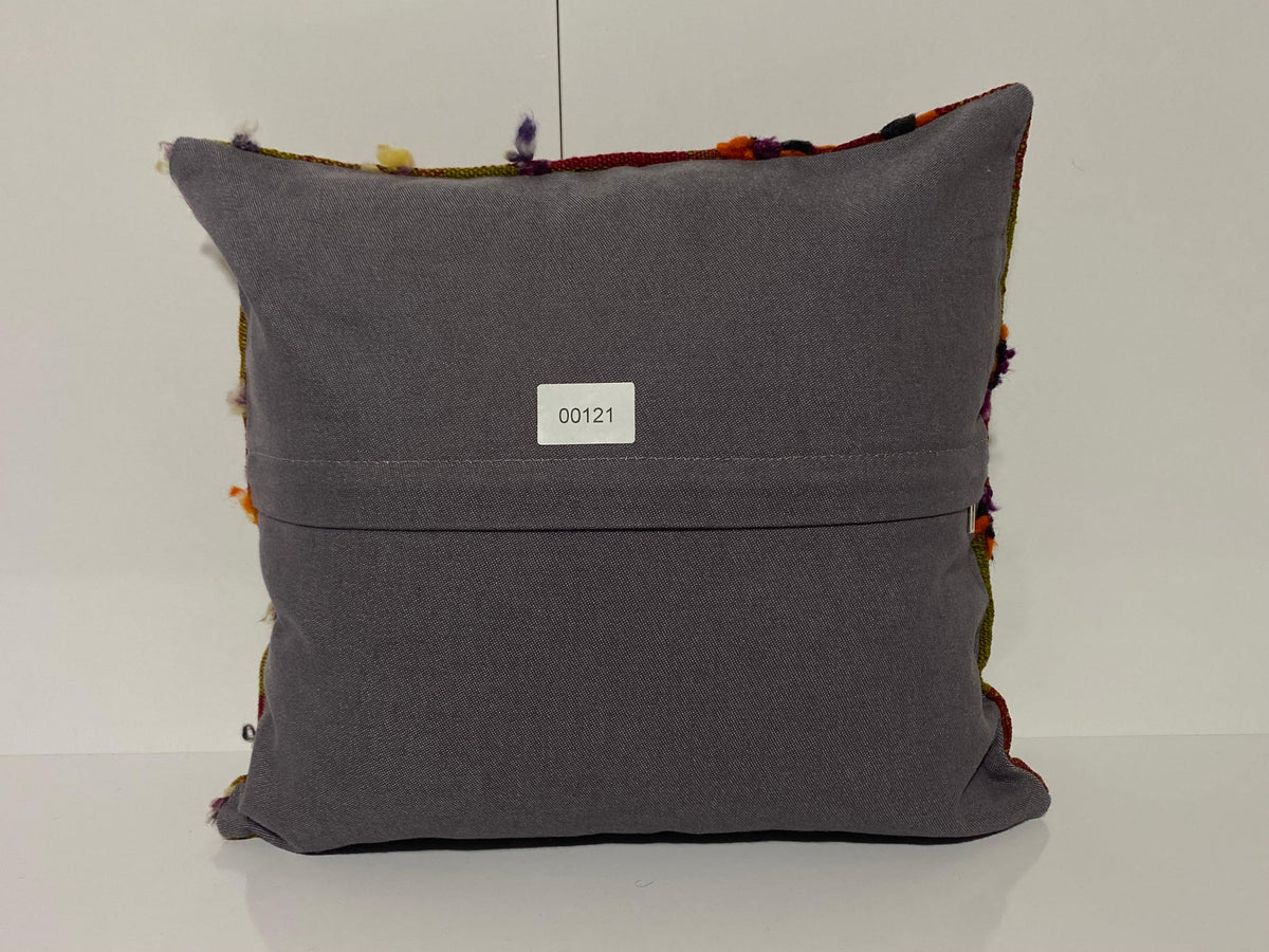 Close-up of the colorful Turkish throw pillow showing traditional details, low pile.
