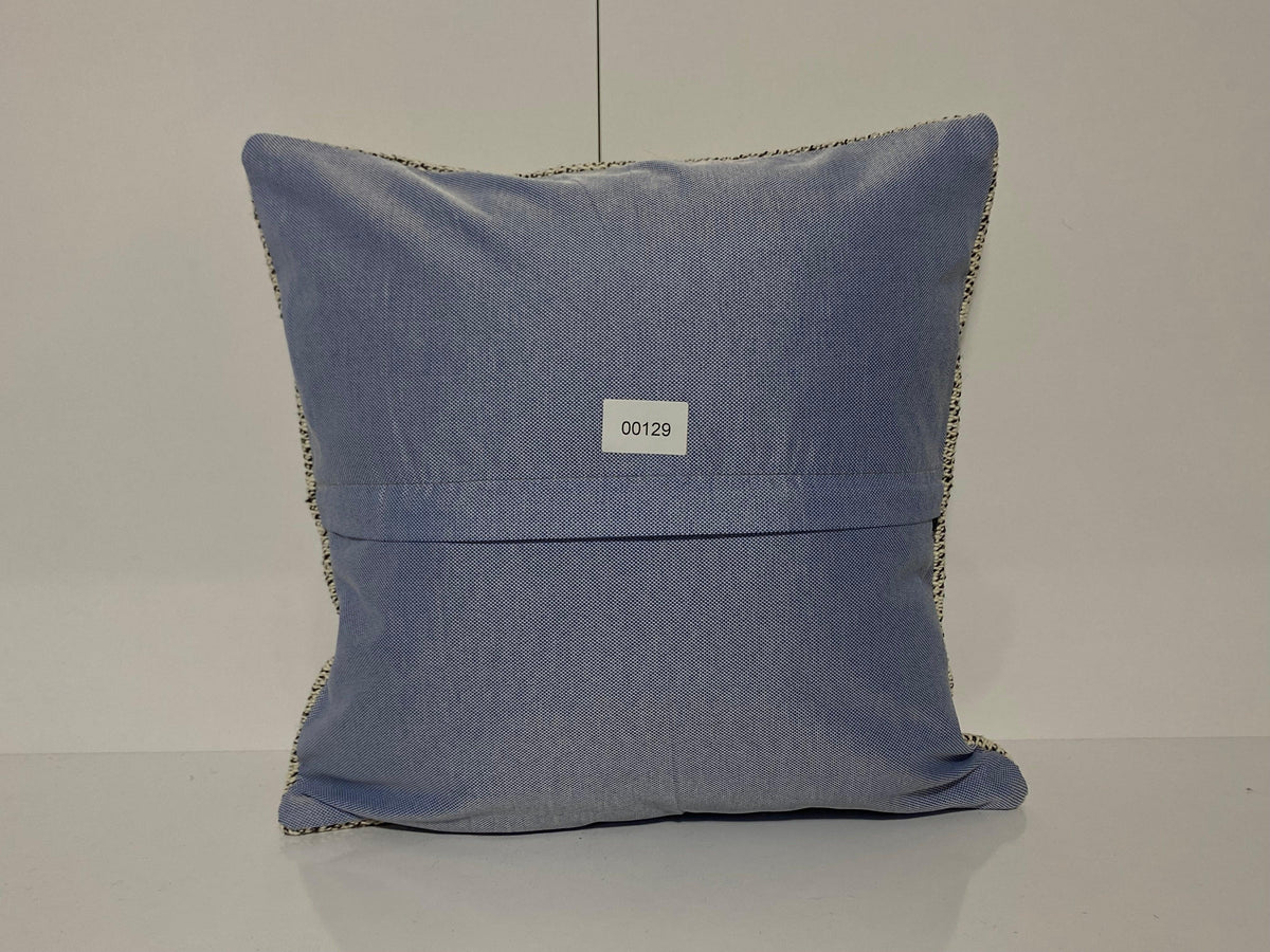 Close-up of the colorful Turkish throw pillow showing traditional details, low pile.