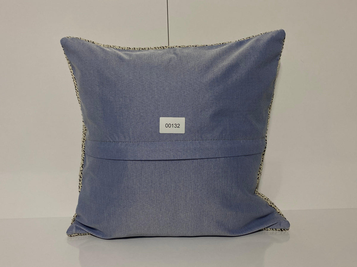Close-up of the colorful Turkish throw pillow showing traditional details, low pile.