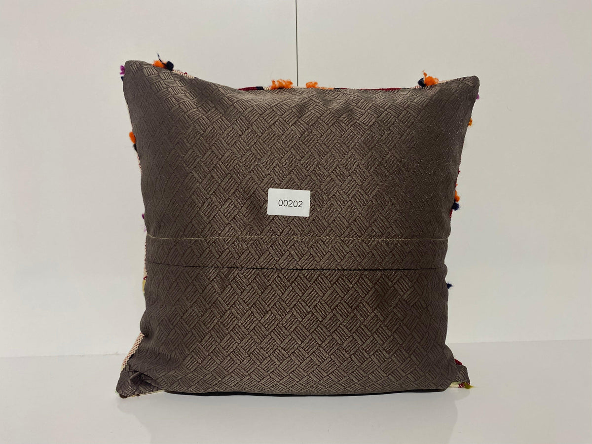 Close-up of the colorful Turkish throw pillow showing traditional details, low pile.