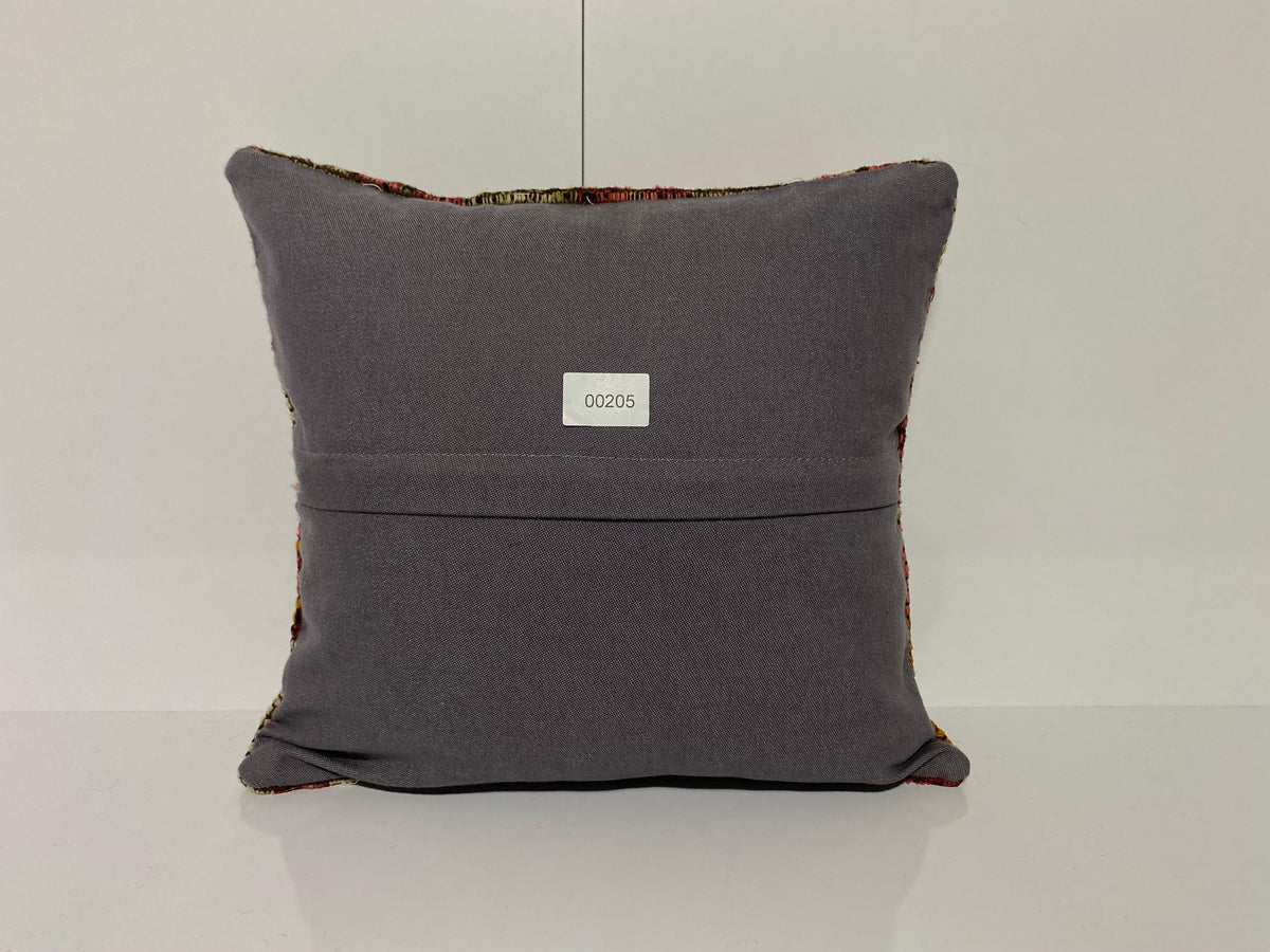 Close-up of the colorful Turkish throw pillow showing traditional details, low pile.