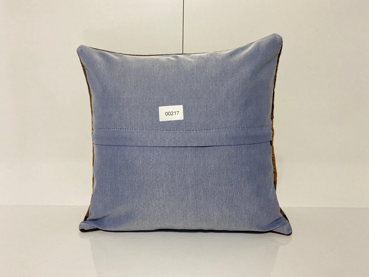 Close-up of the colorful Turkish throw pillow showing geometric details, low pile.