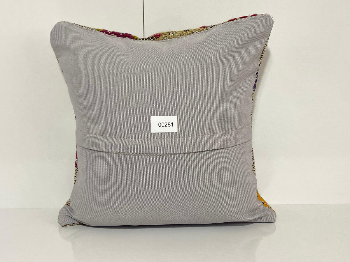 Close-up of the colorful Turkish throw pillow showing traditional details, low pile.