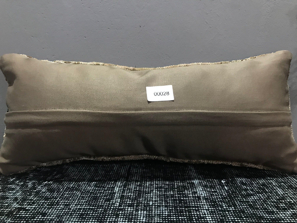 Colorful Turkish throw pillow, shown on the floor.