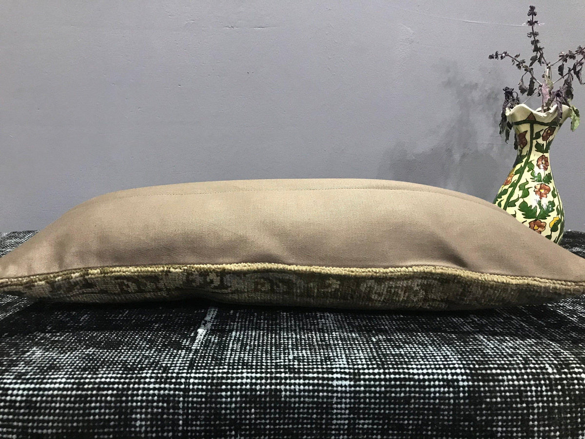 Colorful Turkish throw pillow, shown on the floor.
