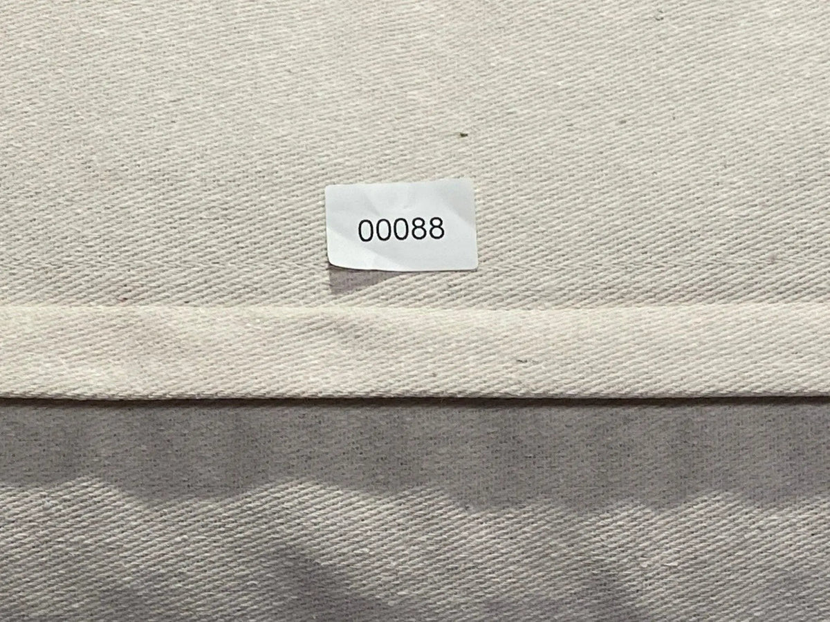 White Turkish throw pillow, shown on the floor.