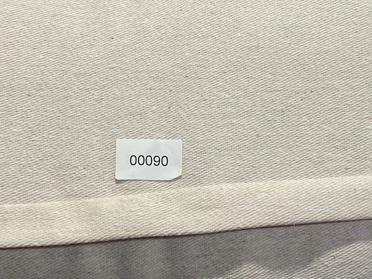 White Turkish throw pillow, shown on the floor.