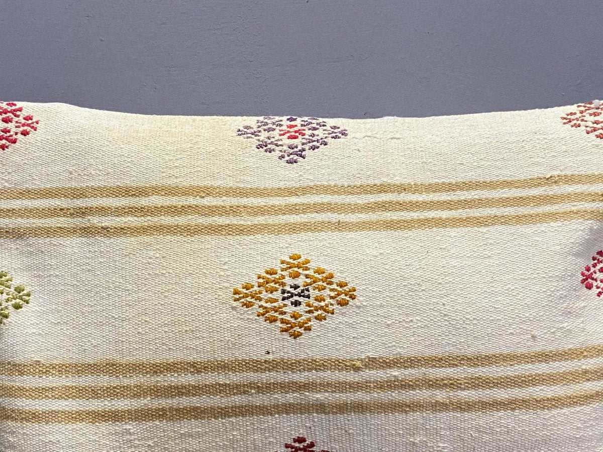 Close-up of the white Turkish throw pillow showing traditional details, low pile.