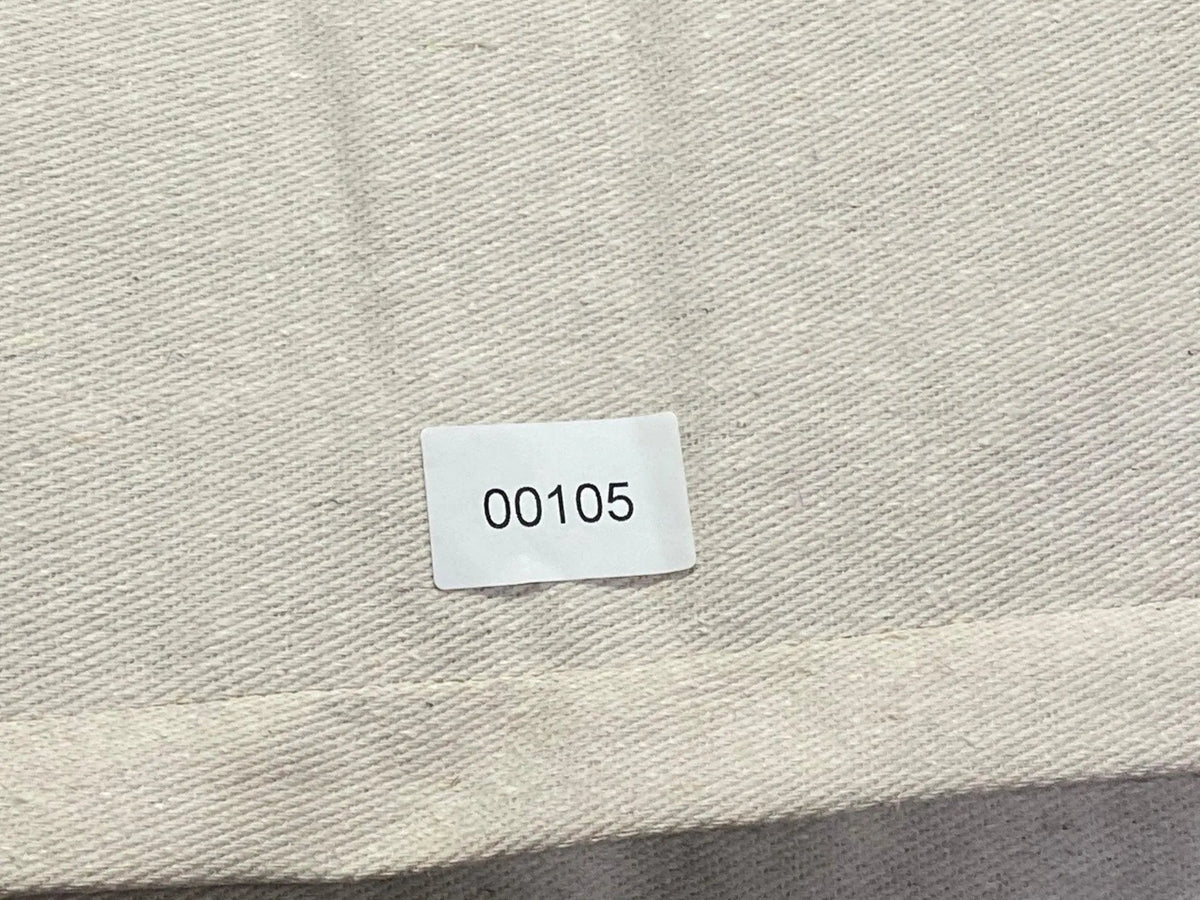 White Turkish throw pillow, shown on the floor.