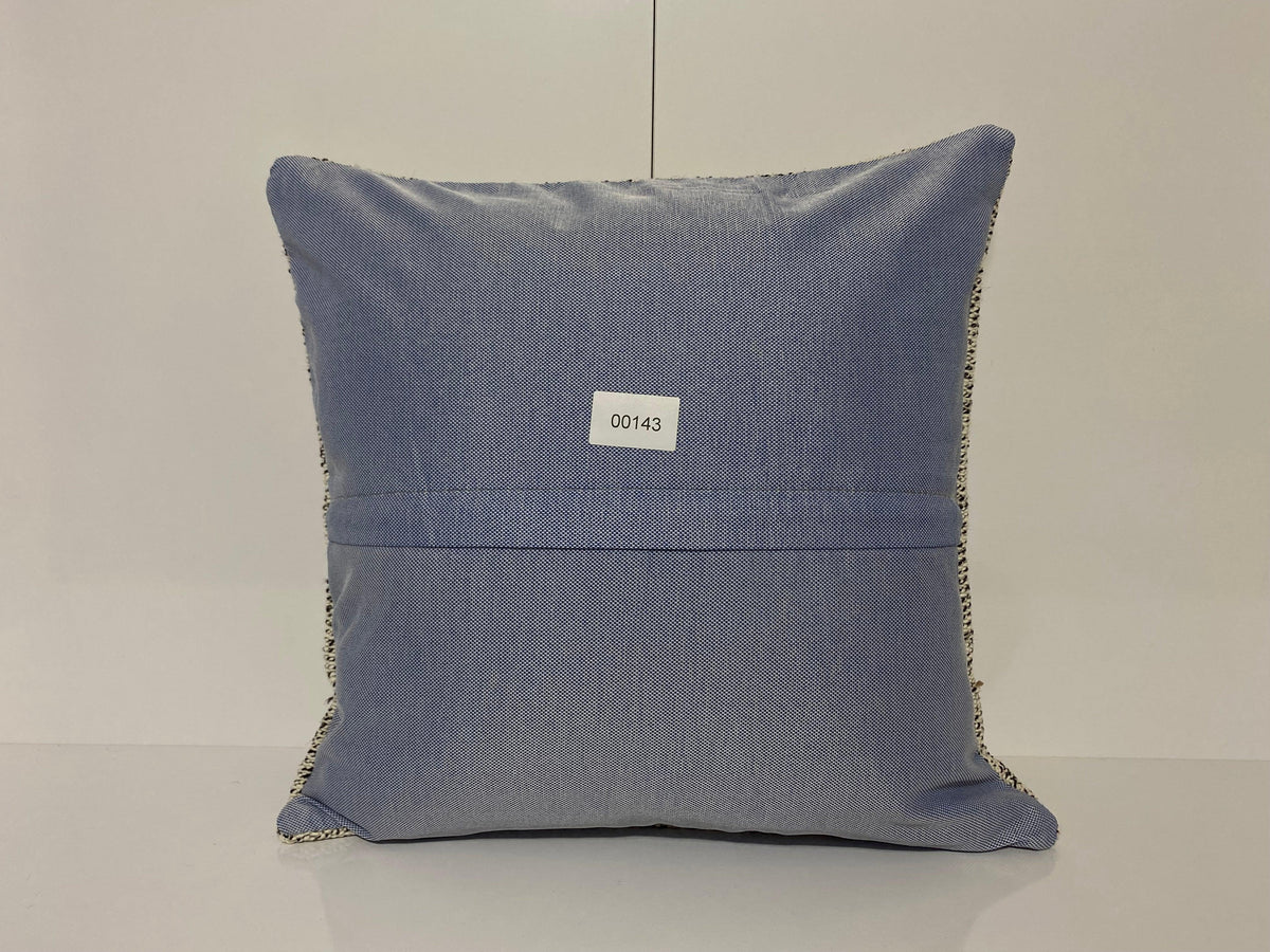 Close-up of the white Turkish throw pillow showing traditional details, low pile.