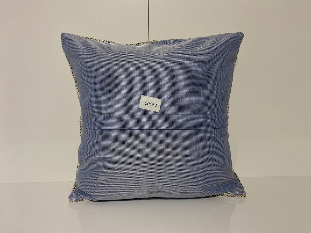Close-up of the white Turkish throw pillow showing traditional details, low pile.