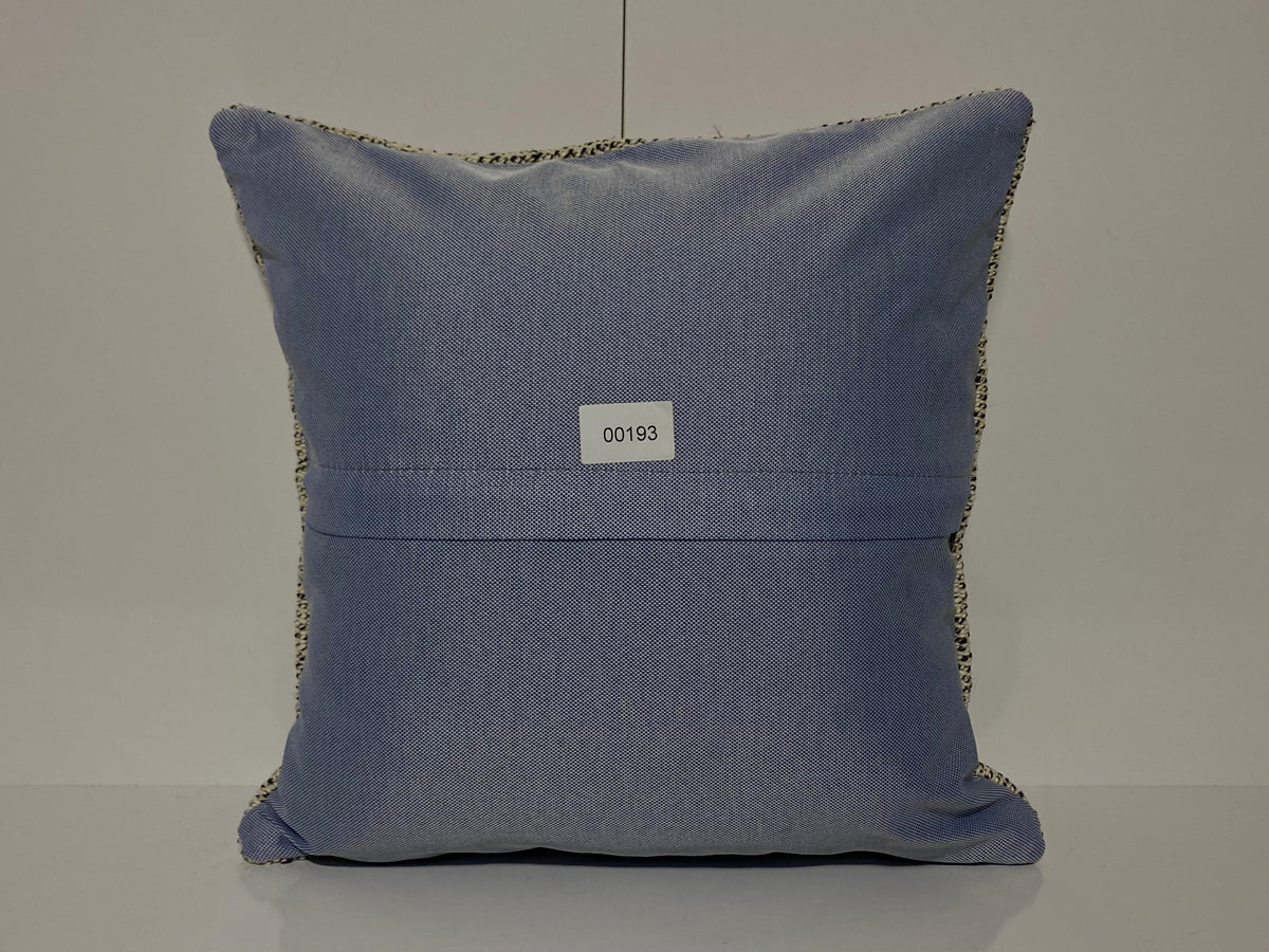 Close-up of the white Turkish throw pillow showing traditional details, low pile.