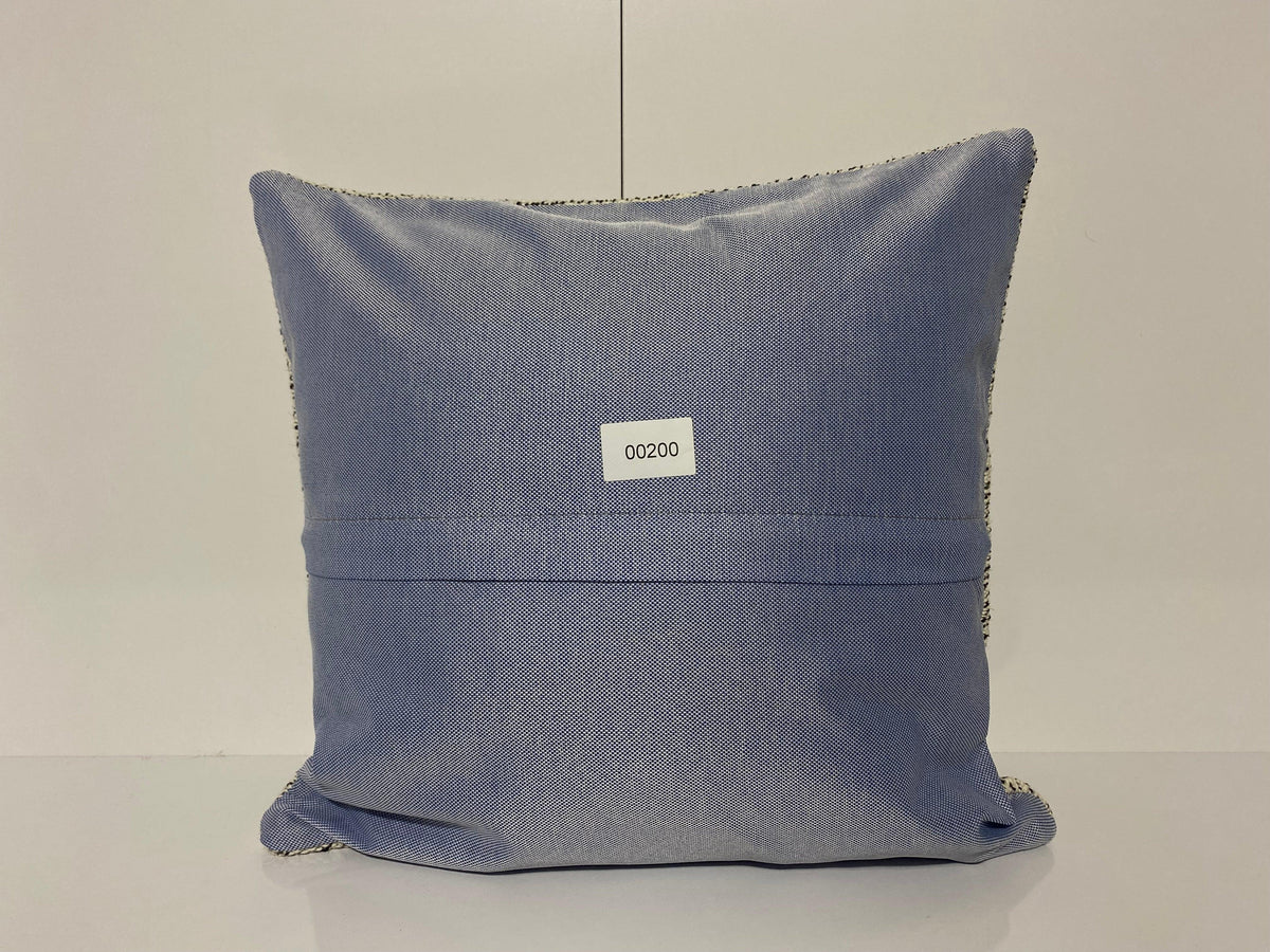 Close-up of the white Turkish throw pillow showing traditional details, low pile.