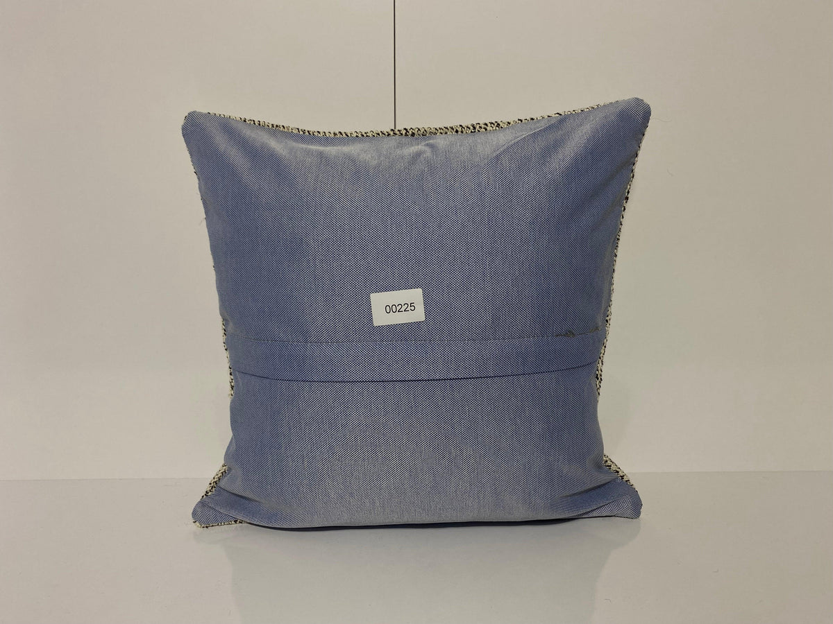 Close-up of the white Turkish throw pillow showing traditional details, low pile.