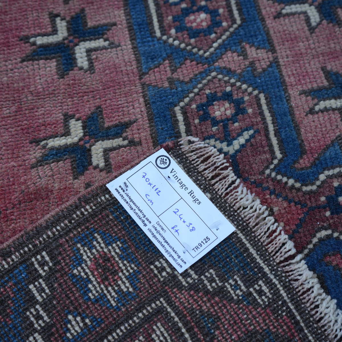 Red 2' x 4' Turkish traditional vintage rug from the 1970s with traditional design.