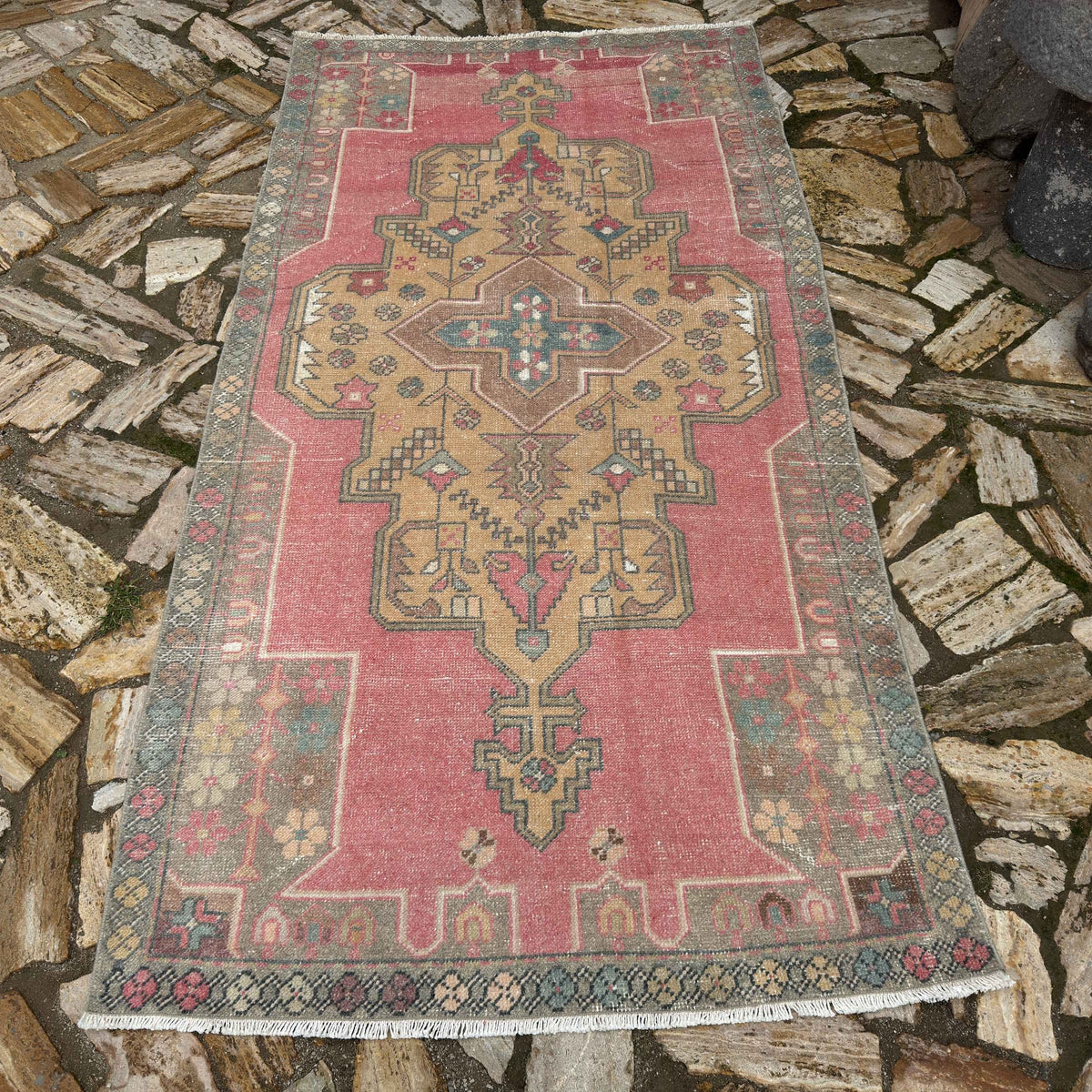 Pale Pink 4' x 7' Turkish traditional vintage rug in wool and cotton, shown on the floor.