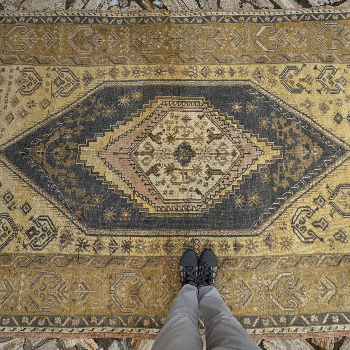 1970s yellow Turkish traditional wool rug with neutral design, hand-knotted weave and low pile.