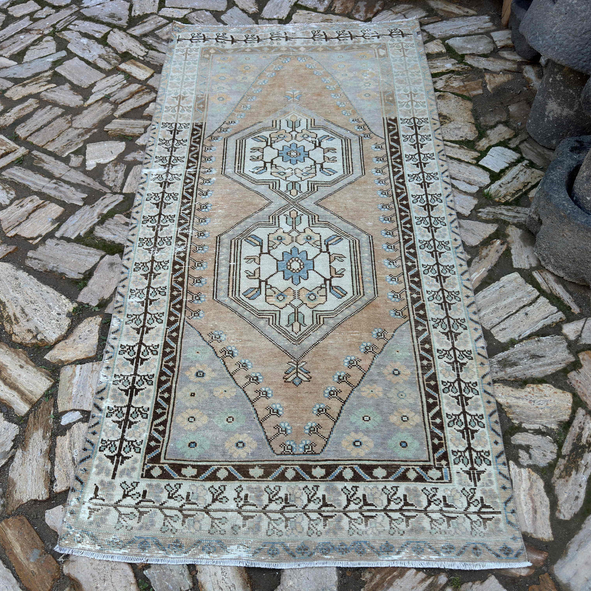 Pale Orange 4' x 8' turkish area rug in wool and cotton, shown on the floor.
