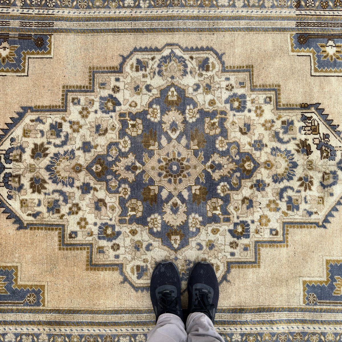 1970s blue turkish area rug with traditional design, hand-knotted weave and low pile.