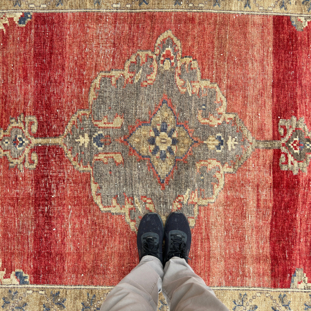 1970s red turkish medallion rug with medallion design, hand-knotted weave and low pile.