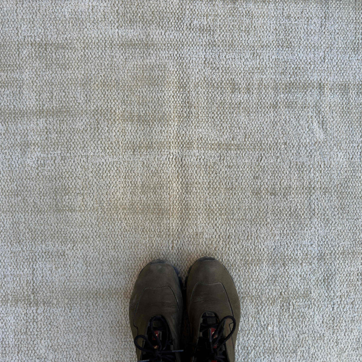 1970s beige turkish rug with neutral design, hand-knotted weave and low pile.
