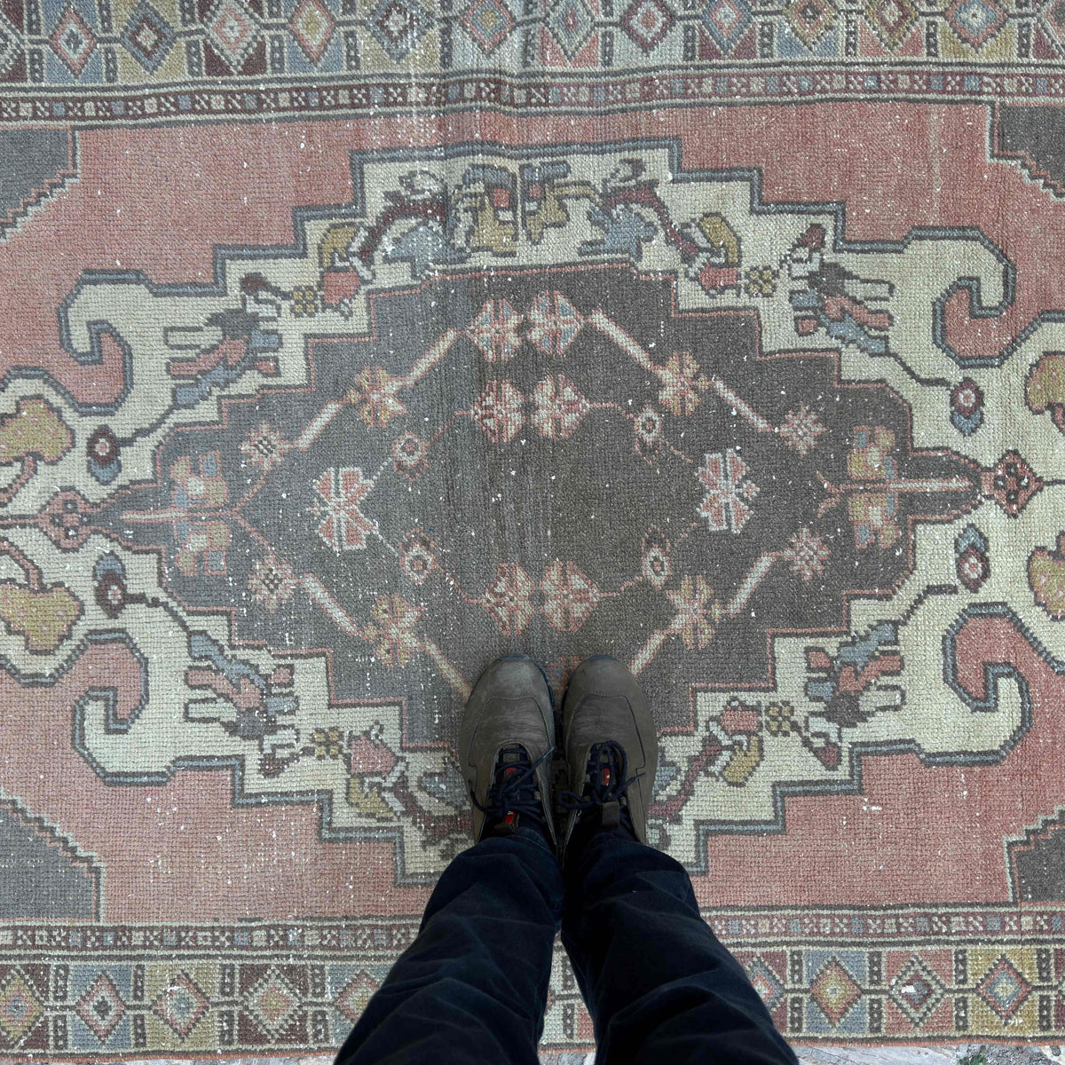 1970s pale red turkish rug with traditional design, hand-knotted weave and low pile.