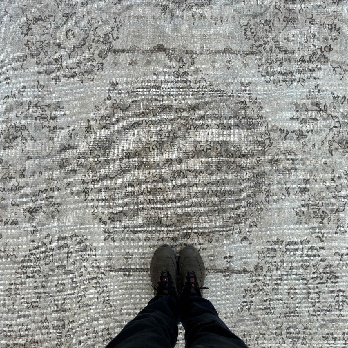 1970s beige turkish rug with neutral design, hand-knotted weave and low pile.
