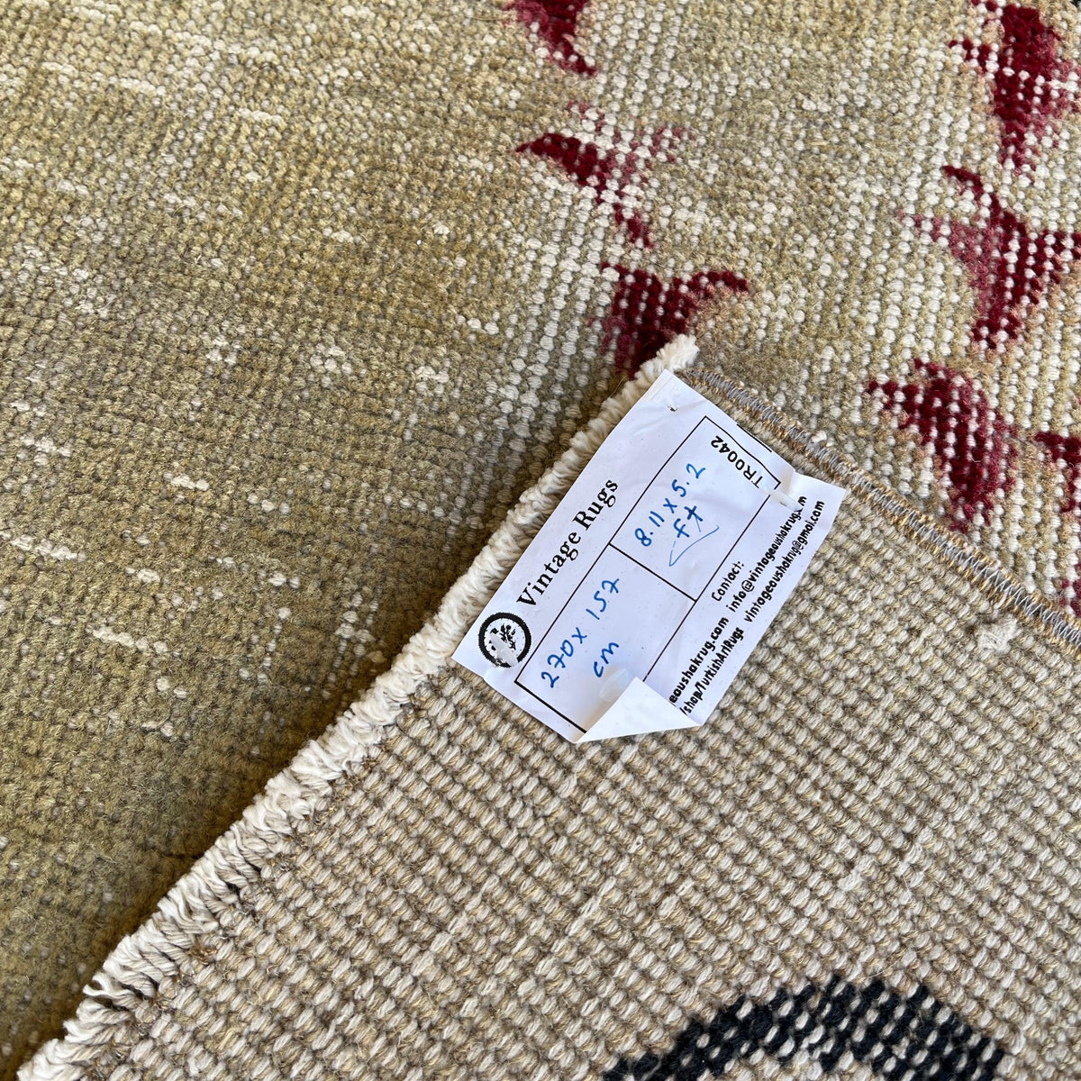 1970s black turkish rug with traditional design, hand-knotted weave and low pile.