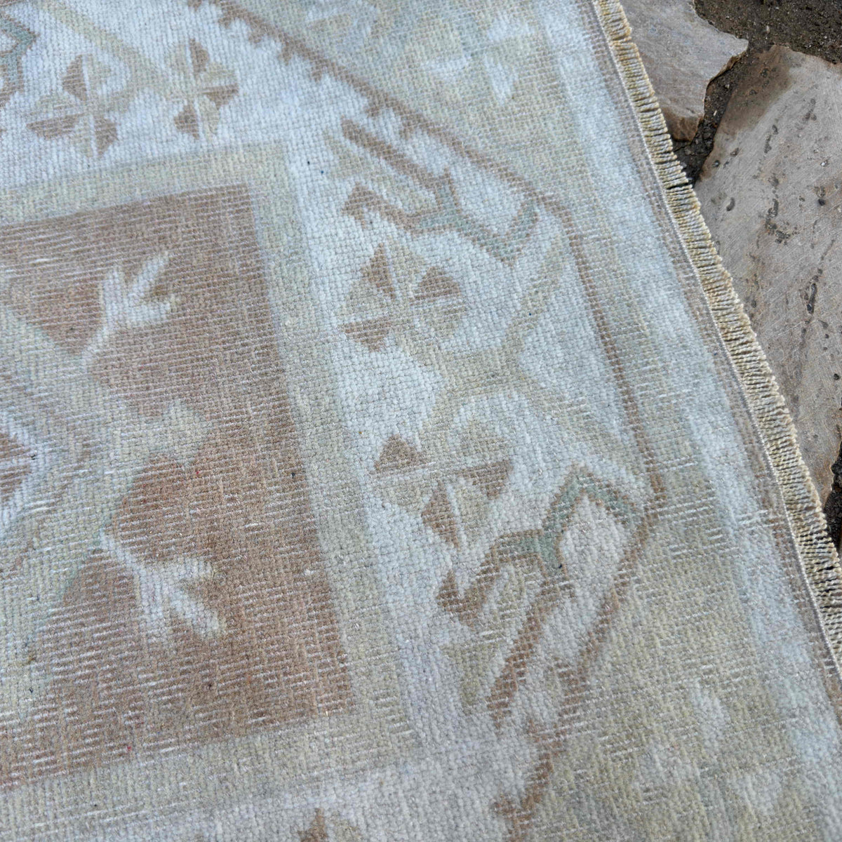 Close-up of the beige turkish runner rug showing neutral details, hand-knotted weave, wool and cotton and low pile.